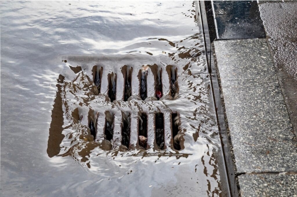 catch basin slow draining from leaves and debris in parking lot