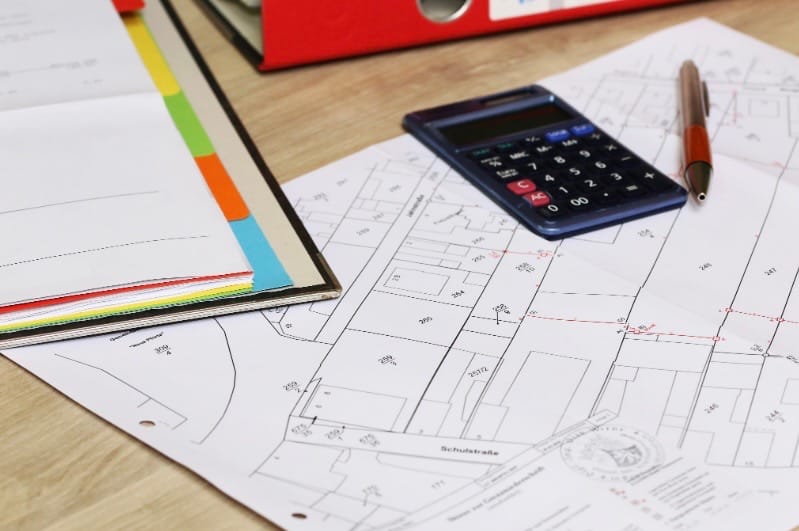 permit process and planning shows calculator and construction plans