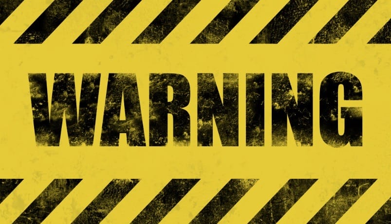 Warning sign, yellow with black writing