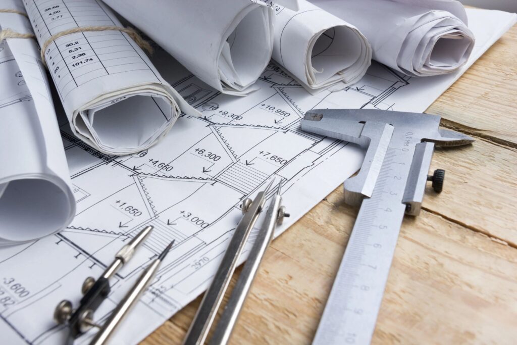 construction plans rolled up with permit for new structure