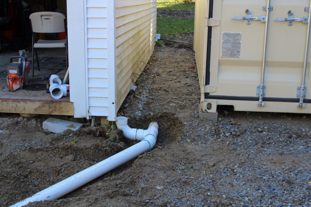 new drainage system installed and integrated with garage gutter drainage in southern new hampshire